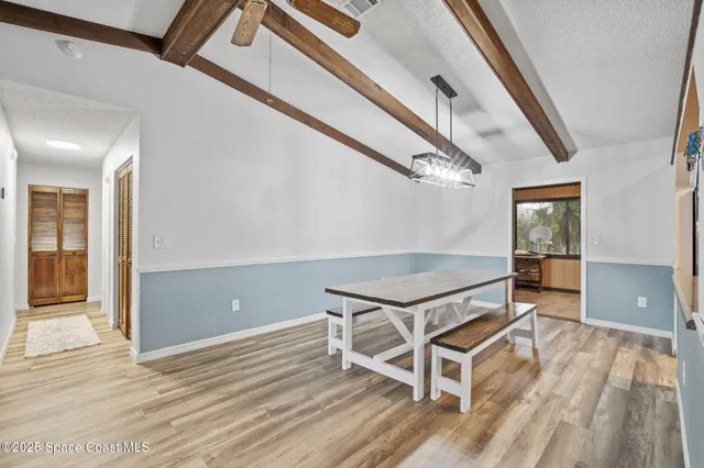 a room with wooden floor and furniture