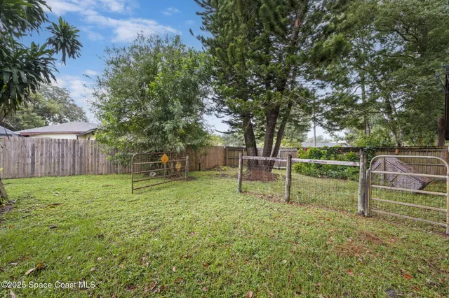 a backyard of a house with lots of green space