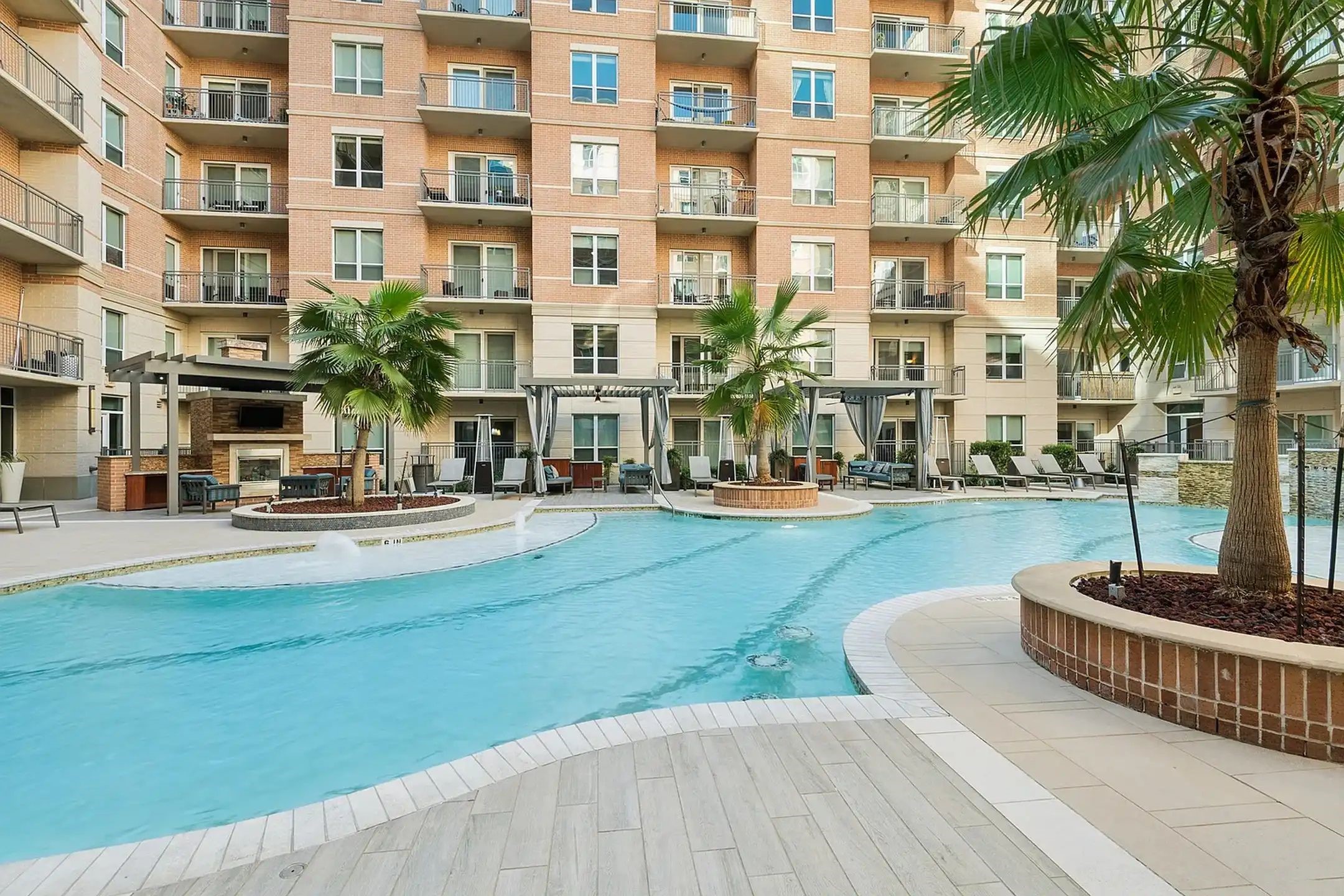 2724 Kipling Street, Unit 335 Houston, TX 77098 - Photo 25 of 29 Just steps away are sleek lounge chairs, inviting you to sunbathe by the pool before a refreshing dip. With lush palms, integrated water features, and distinct social 'zones', this space is your personal sanctuary for both relaxation and upscale entertainment.