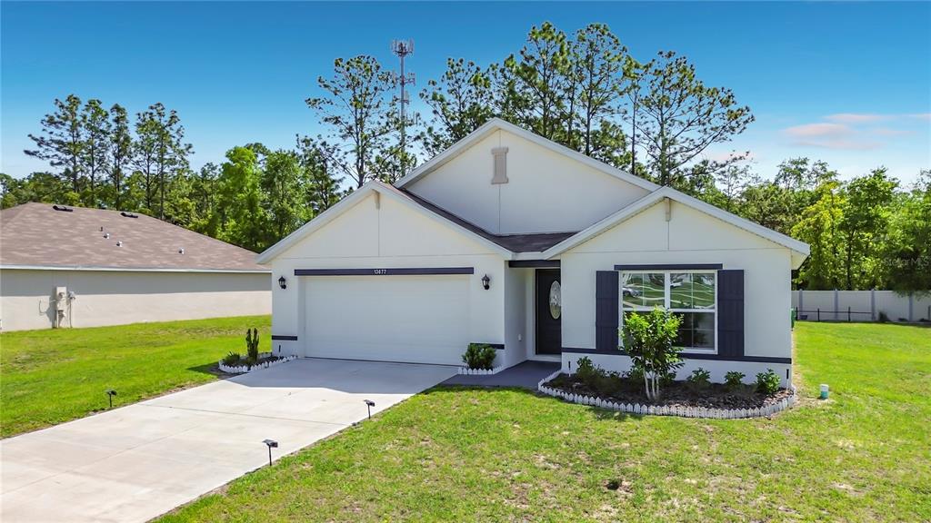 13677 Southwest 69th Terrace Ocala, FL 34473 - Photo 1 of 28 a view of a house with backyard and garden