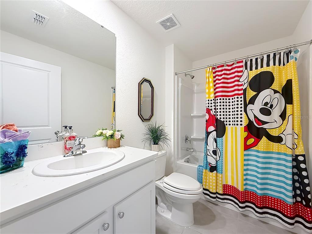 13677 Southwest 69th Terrace Ocala, FL 34473 - Photo 19 of 28 a bathroom with a sink and a mirror