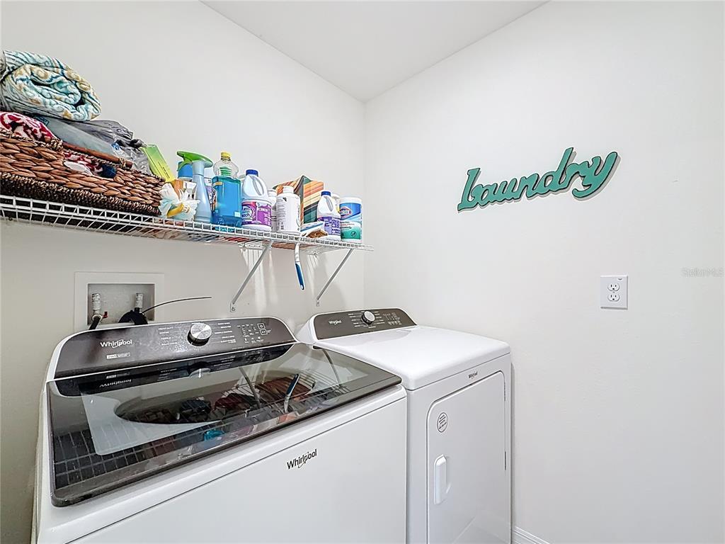 13677 Southwest 69th Terrace Ocala, FL 34473 - Photo 21 of 28 a kitchen with a stove and a cabinets