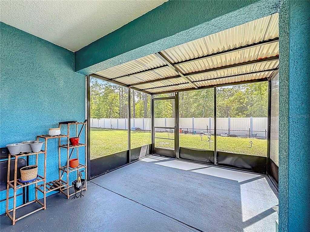 13677 Southwest 69th Terrace Ocala, FL 34473 - Photo 22 of 28 a view of a room with wooden floor and windows
