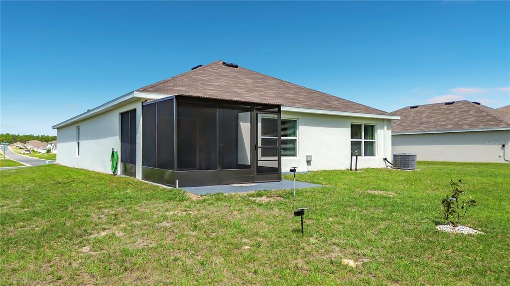 13677 Southwest 69th Terrace Ocala, FL 34473 - Photo 24 of 28 a view of an house with backyard space and garden