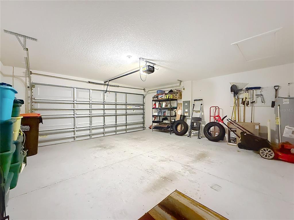 13677 Southwest 69th Terrace Ocala, FL 34473 - Photo 26 of 28 a view of a garage with parked cars