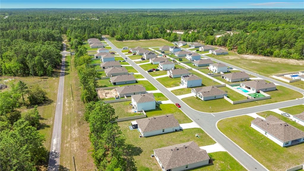 13677 Southwest 69th Terrace Ocala, FL 34473 - Photo 28 of 28 an aerial view of residential houses with outdoor space and trees