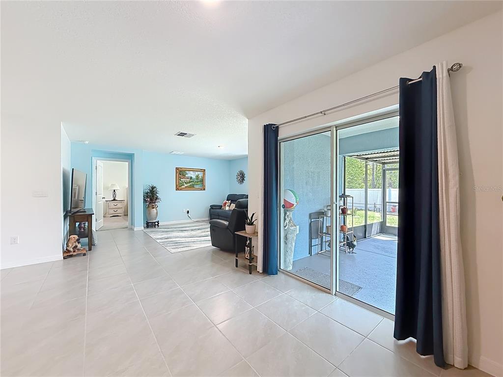 13677 Southwest 69th Terrace Ocala, FL 34473 - Photo 10 of 28 a view of a livingroom with furniture and a window