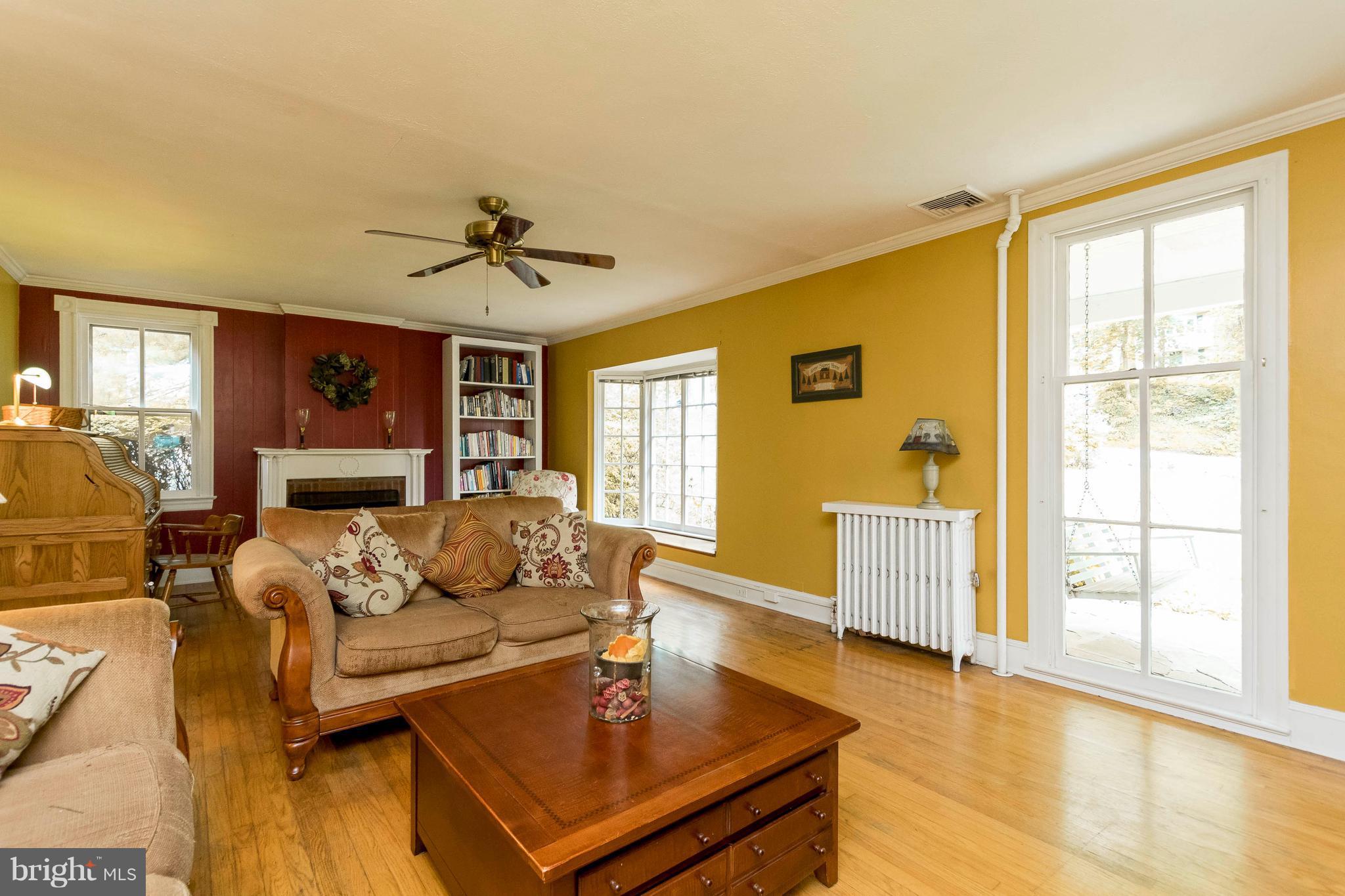 Living Room w/Hardwood Flooring & Bay Window