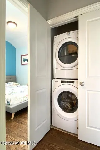 a view of a hallway with washer and dryer