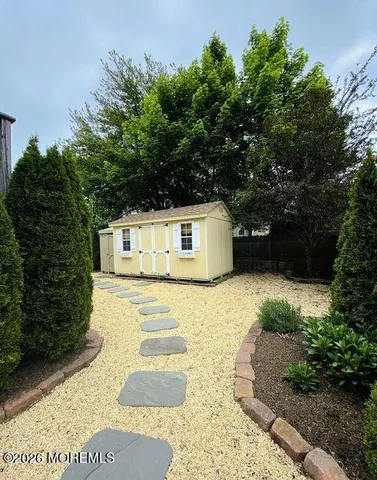 a front view of a house with trees