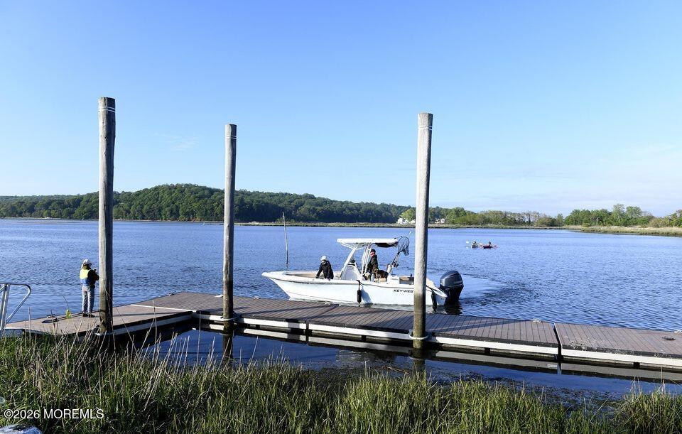 18 Meadowbrook Avenue Rumson, NJ 07760 - Photo 19 of 19 a view of a lake with a floor to ceiling window and wooden floor
