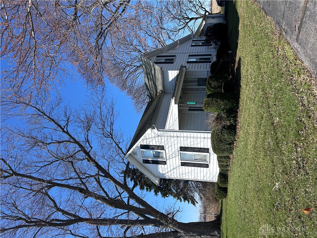 3300 Washington Road Covington, OH 45318 - Photo 1 of 1 This charming residence features classic architecture, a well-maintained lawn, and mature trees.