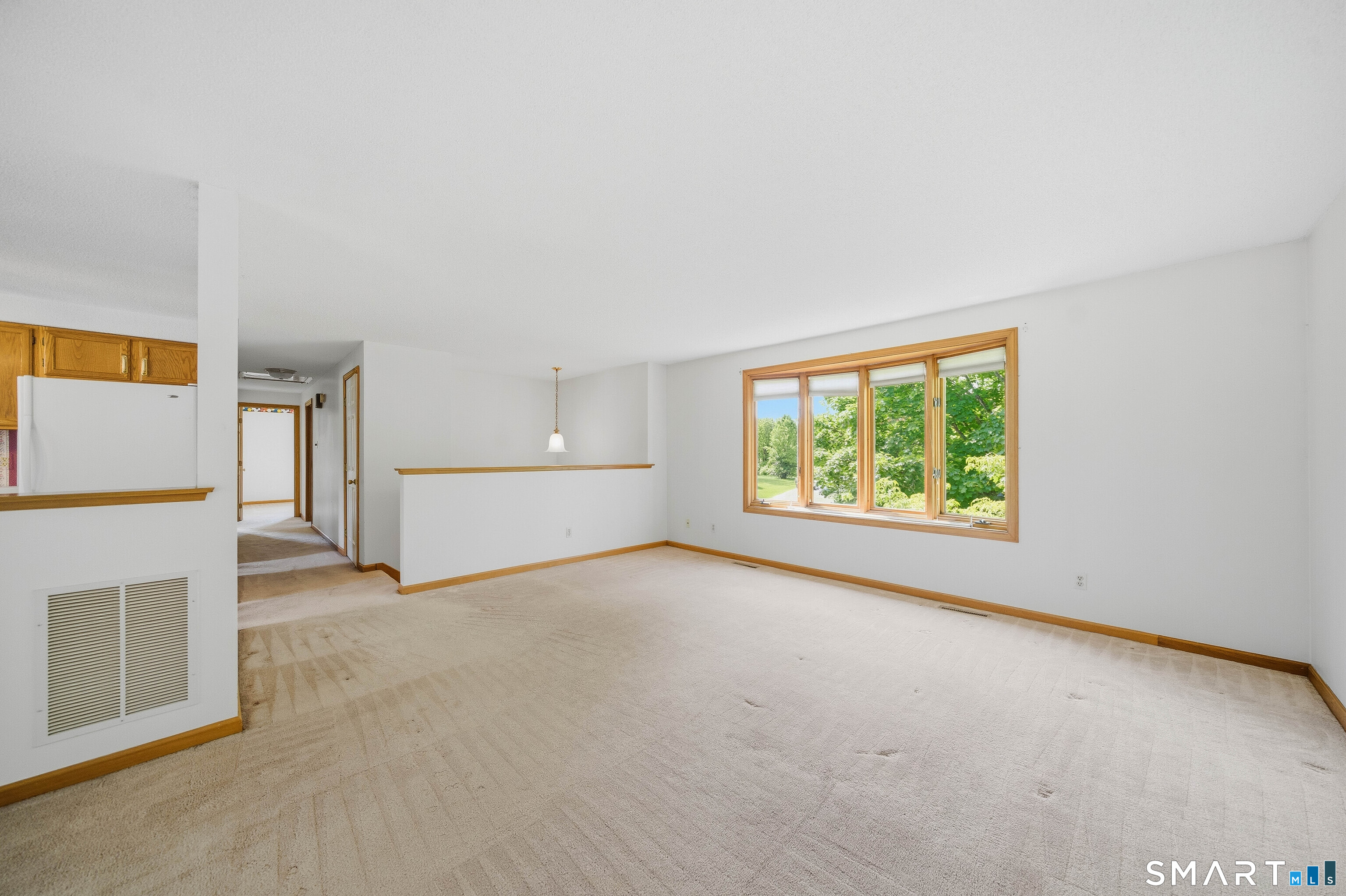 17 Spruceland Road Enfield, CT 06082 - Photo 17 of 40 Living room open to the entrance foyer