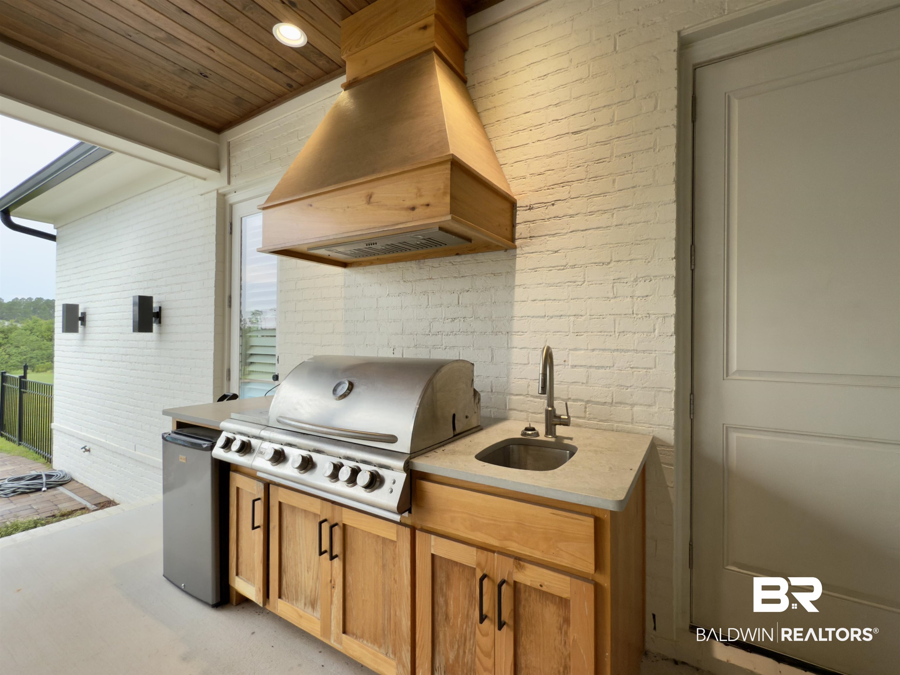 21767 Gallery Boulevard Fairhope, AL 36532 - Photo 59 of 74 View of patio with a sink and exterior kitchen