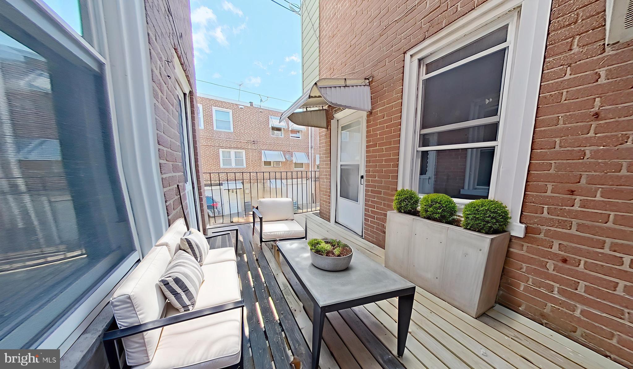 4013 Higbee Street Philadelphia, PA 19135 - Photo 5 of 39 Virtually Staged Kitchen Deck