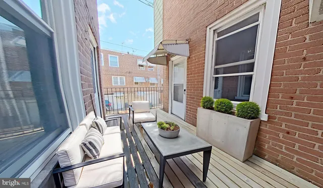 a living room with furniture and window