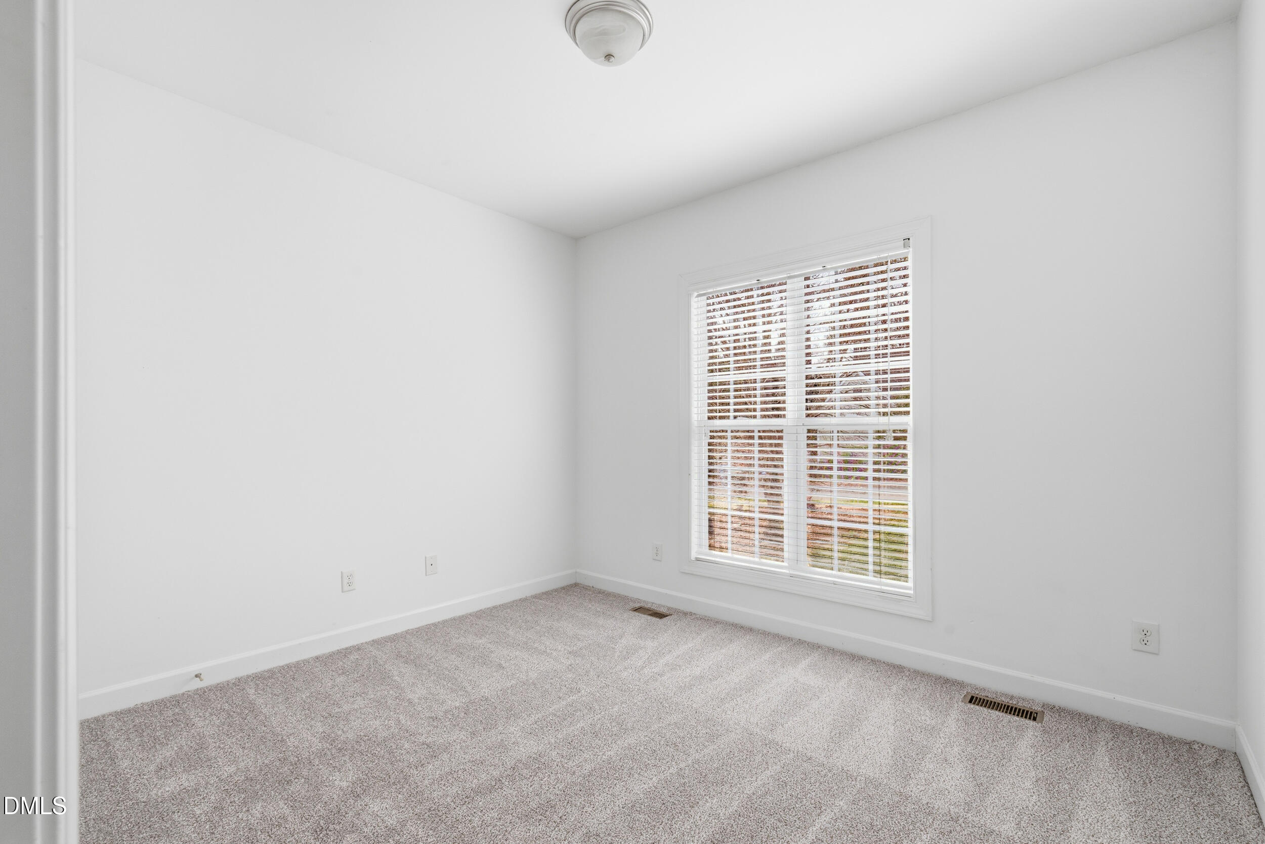 66 Bellemont Road Pittsboro, NC 27312 - Photo 12 of 33 an empty room with windows