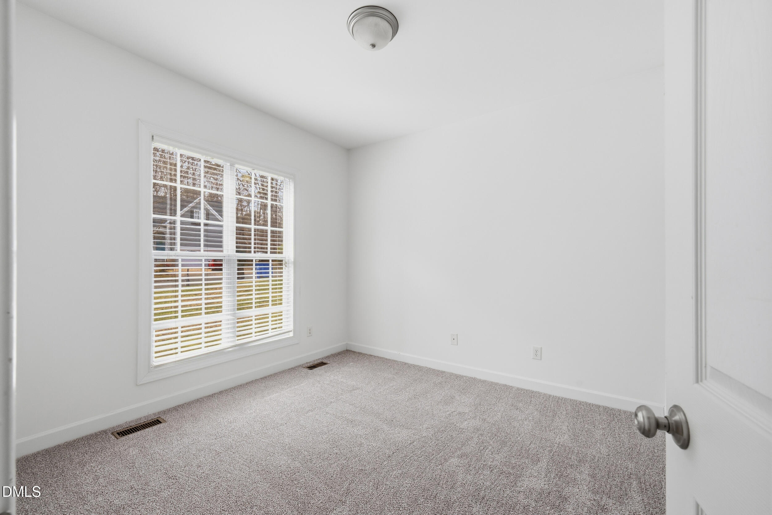 66 Bellemont Road Pittsboro, NC 27312 - Photo 13 of 33 an empty room with windows