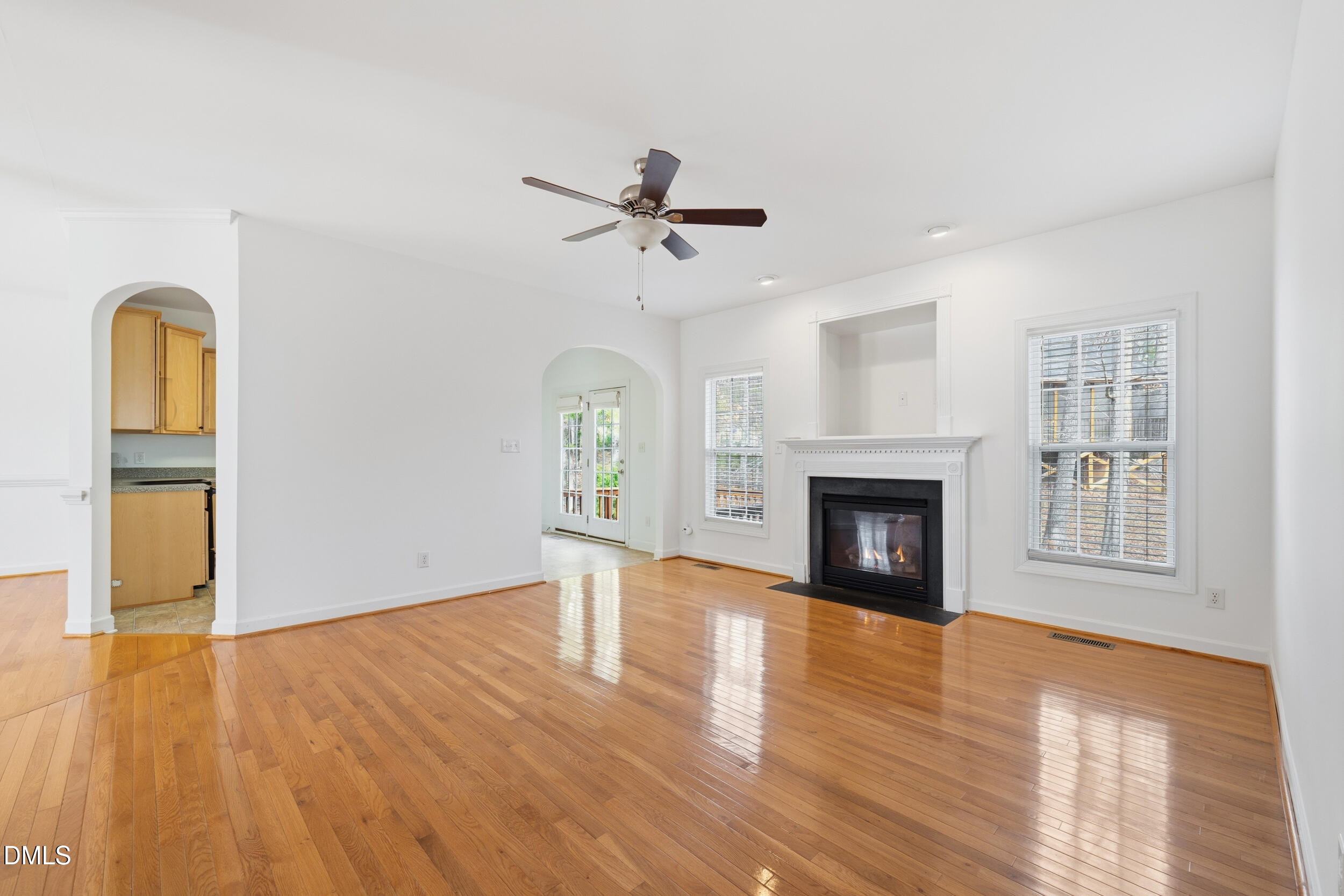66 Bellemont Road Pittsboro, NC 27312 - Photo 14 of 33 a view of an empty room with a fireplace and wooden floor
