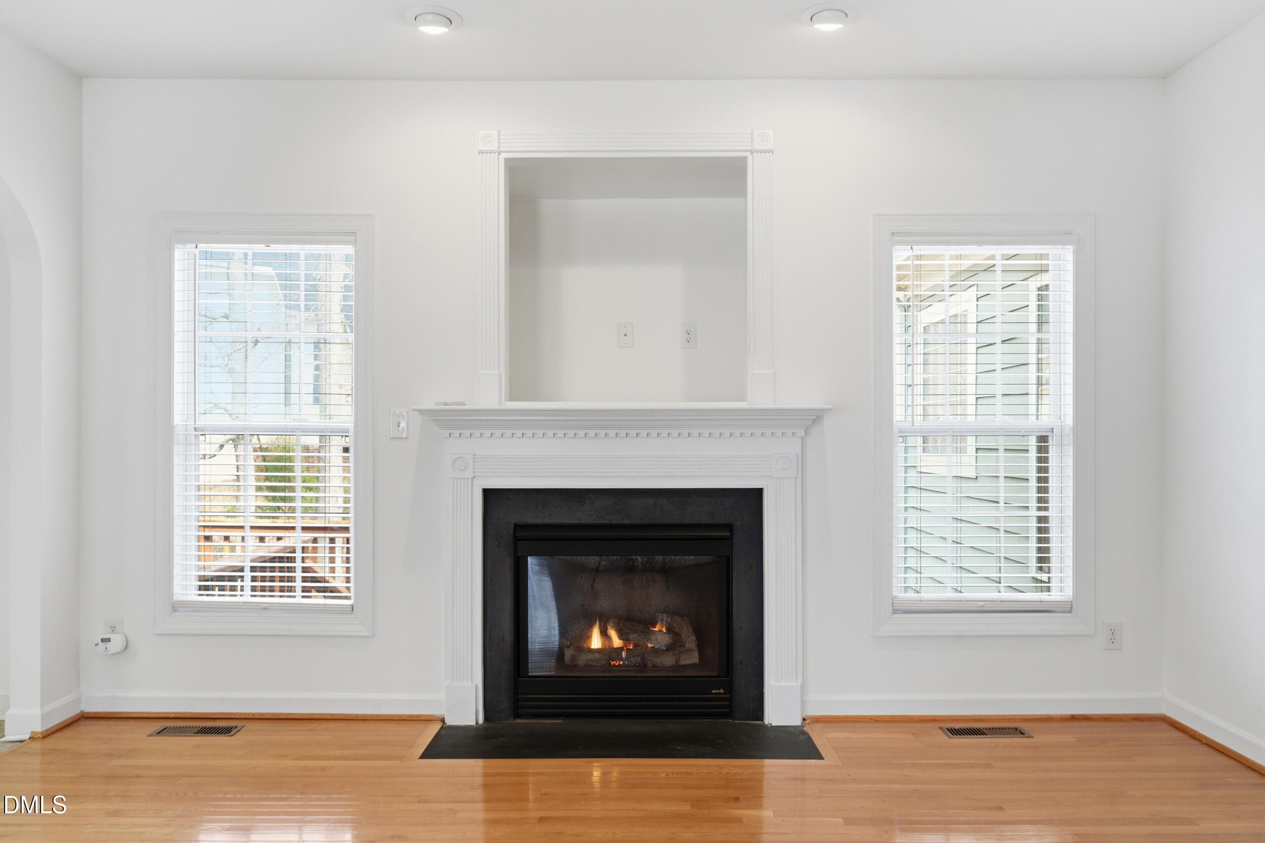 66 Bellemont Road Pittsboro, NC 27312 - Photo 15 of 33 a living room with a fireplace and a window