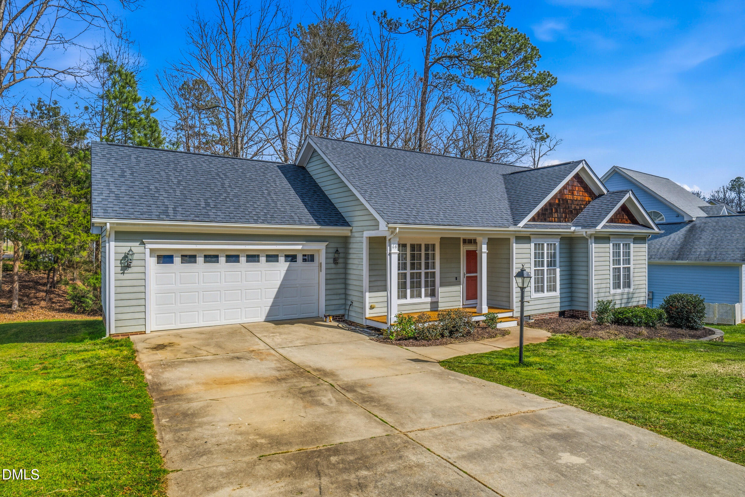 66 Bellemont Road Pittsboro, NC 27312 - Photo 25 of 33 a front view of a house with garden