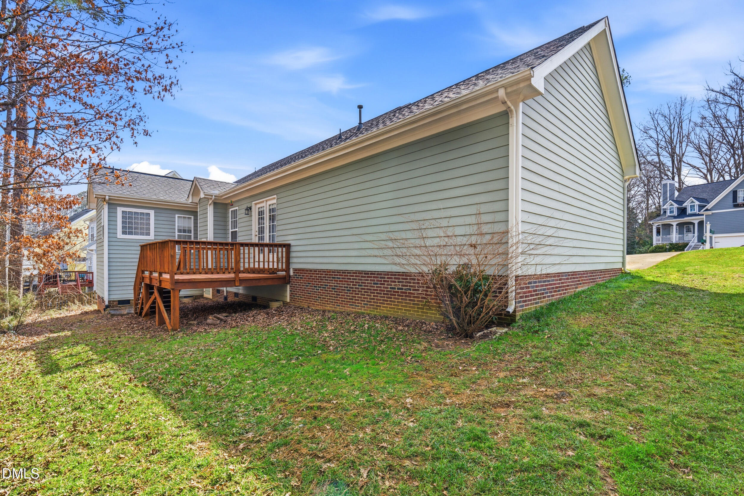 66 Bellemont Road Pittsboro, NC 27312 - Photo 26 of 33 a view of backyard with barbeque grill and brick wall