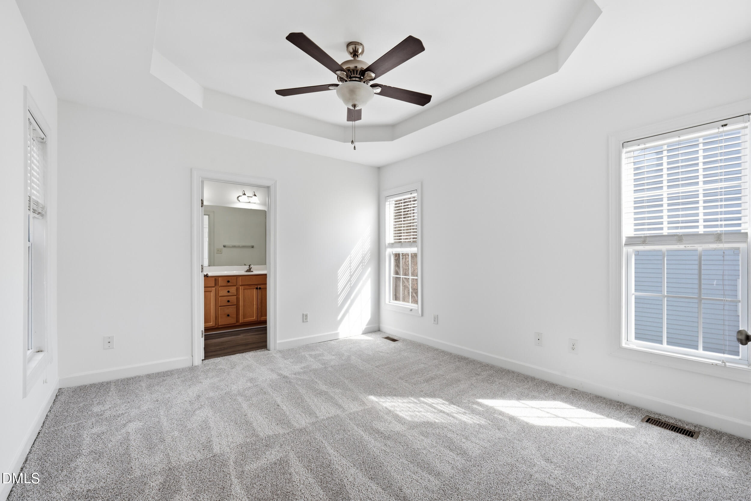 66 Bellemont Road Pittsboro, NC 27312 - Photo 6 of 33 an empty room with windows and ceiling fan