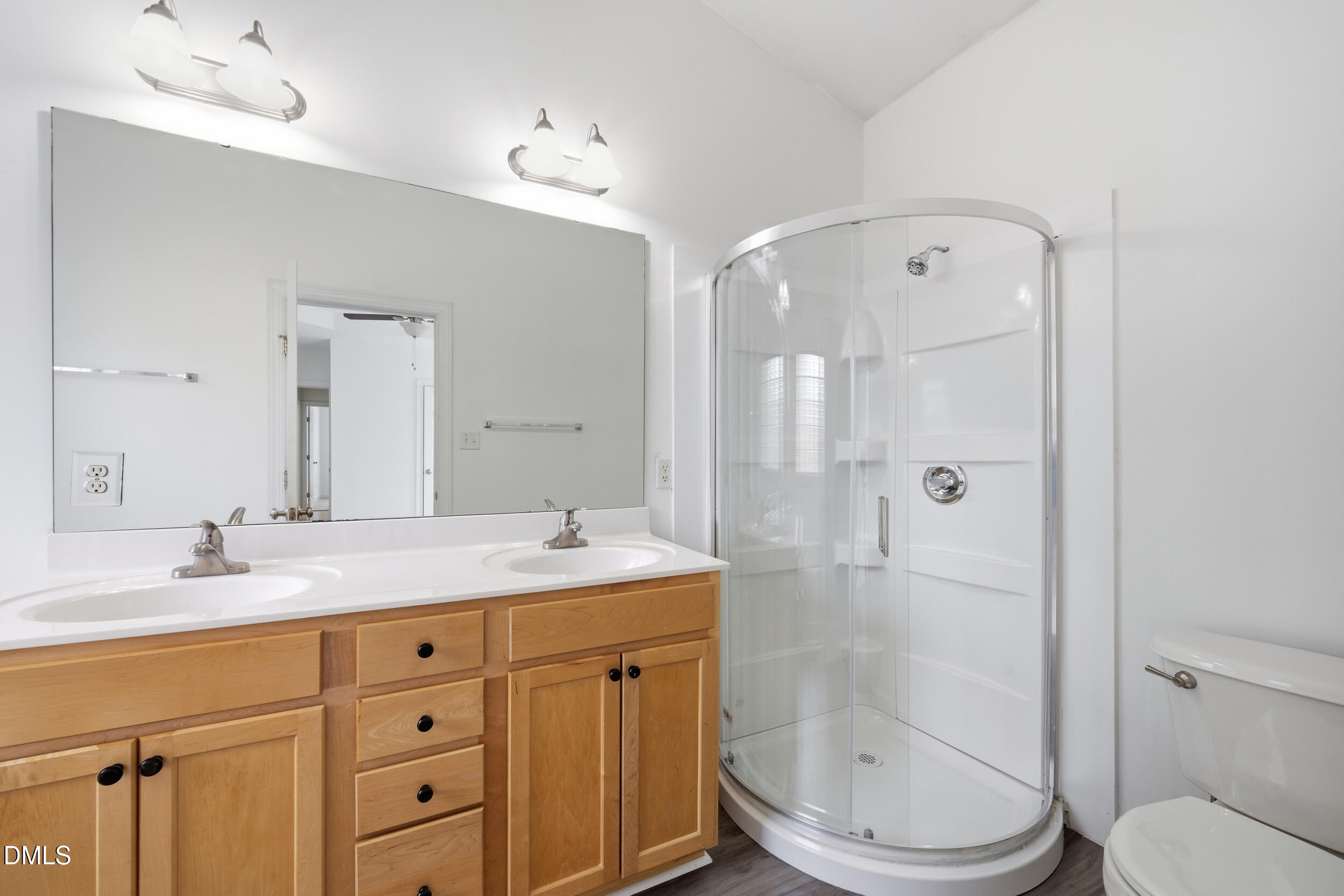 66 Bellemont Road Pittsboro, NC 27312 - Photo 7 of 33 a bathroom with a granite countertop sink toilet a mirror a shower and vanity