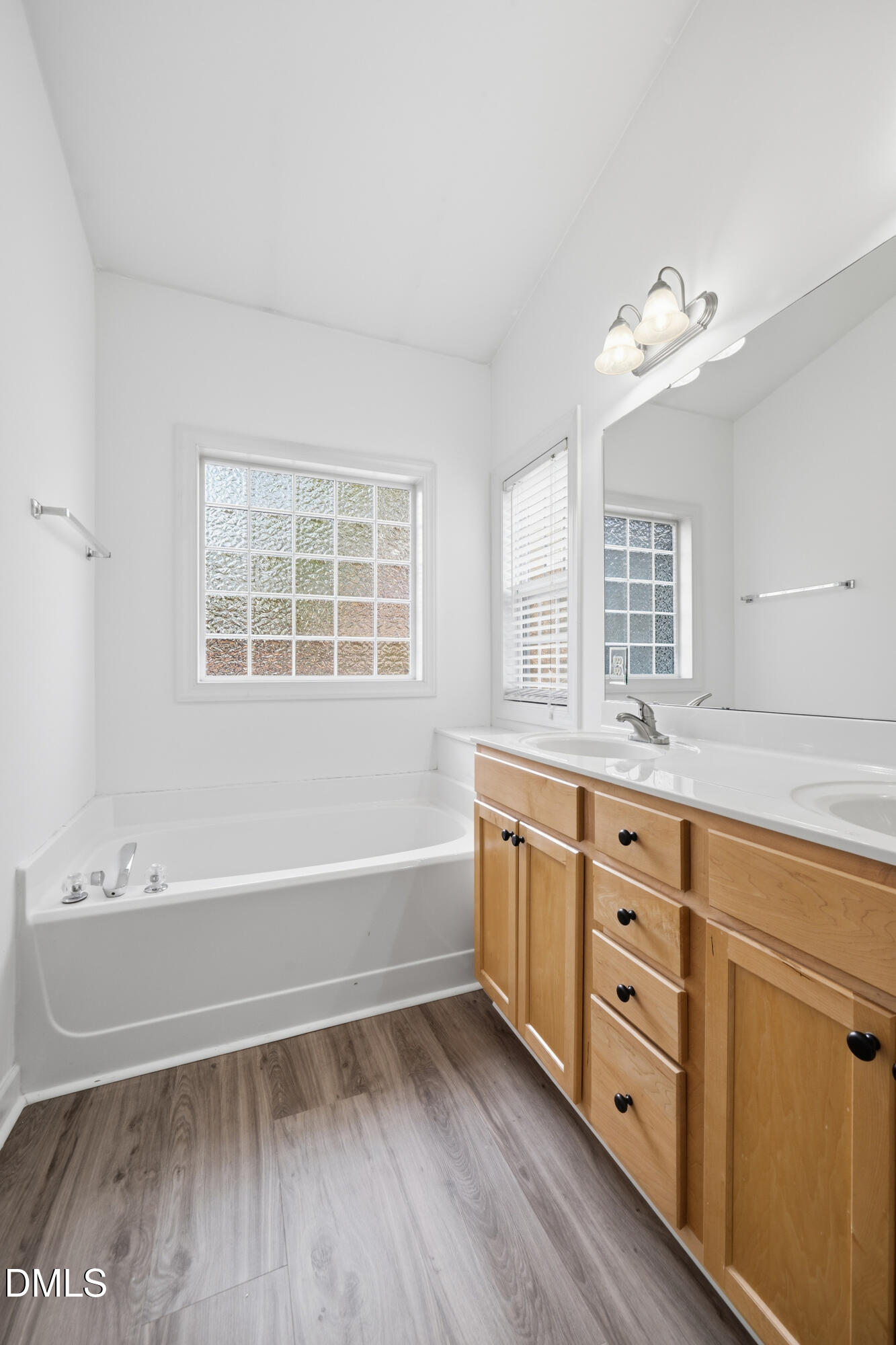 66 Bellemont Road Pittsboro, NC 27312 - Photo 8 of 33 a bathroom with a tub sink double vanity granite and a bathtub