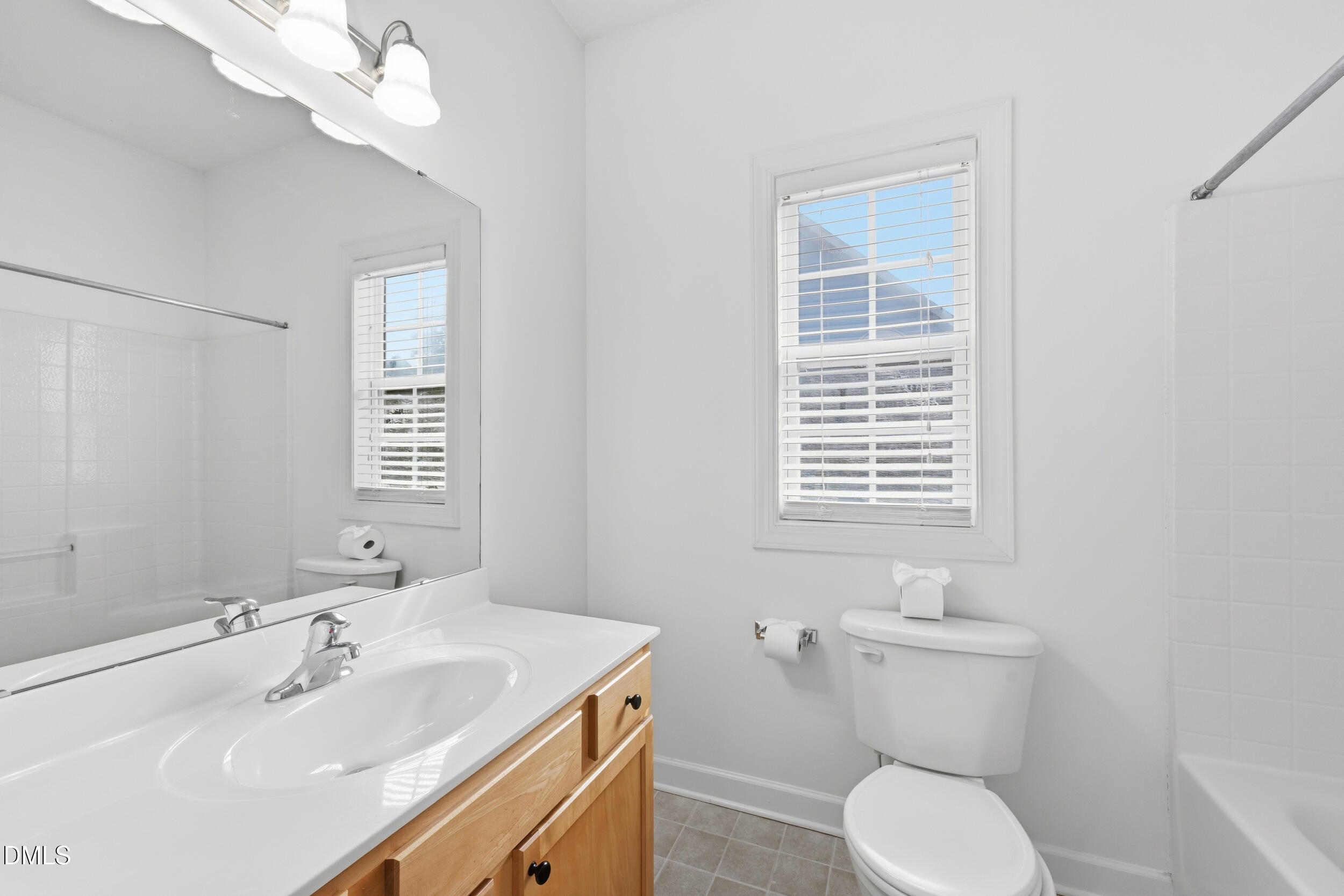 66 Bellemont Road Pittsboro, NC 27312 - Photo 10 of 33 a bathroom with a sink a toilet and a mirror