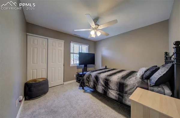 a bed room with a bed and a tv