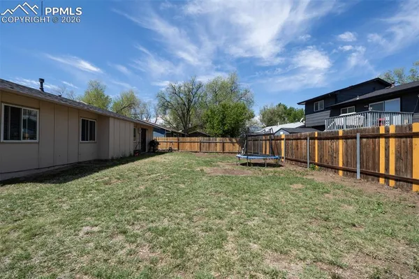 a view of backyard with green space