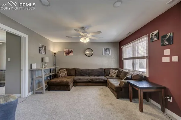 a living room with furniture and a window