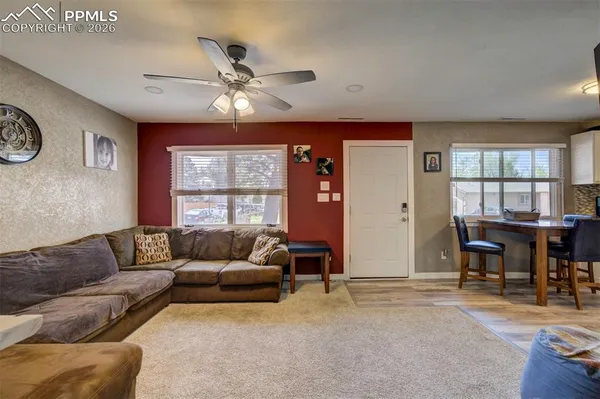 a living room with furniture and a window