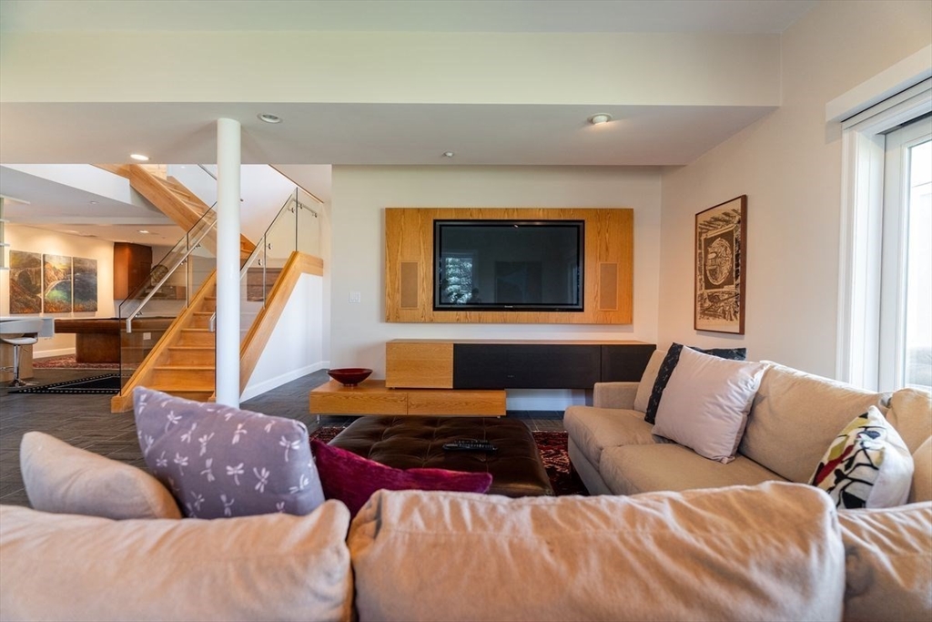 1 South Cottage Road, Unit 1 Belmont, MA 02478 - Photo 15 of 35 a living room with furniture and a flat screen tv