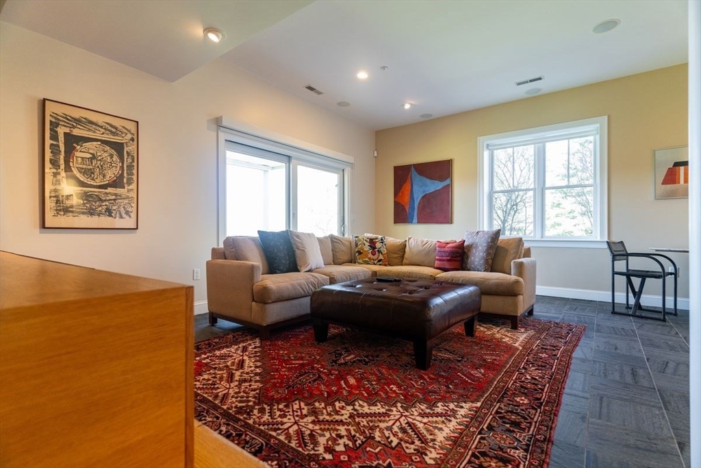 1 South Cottage Road, Unit 1 Belmont, MA 02478 - Photo 16 of 35 a living room with furniture and a window