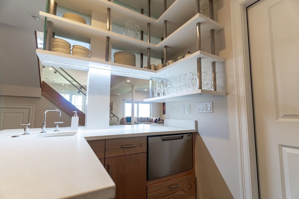 1 South Cottage Road, Unit 1 Belmont, MA 02478 - Photo 20 of 35 a kitchen with a sink and cabinets