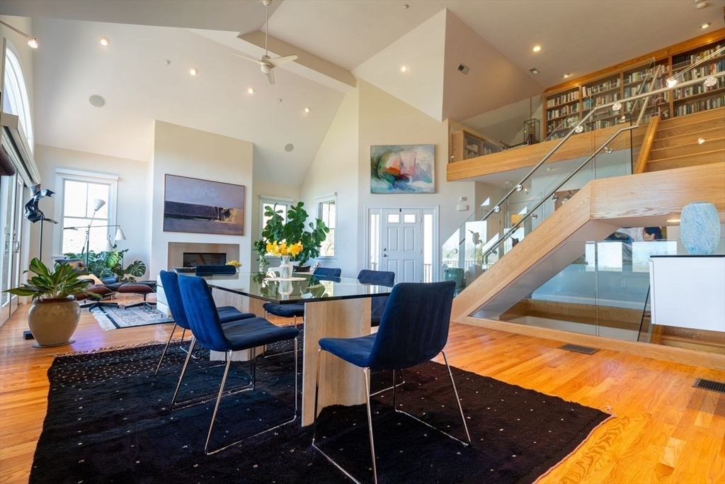 1 South Cottage Road, Unit 1 Belmont, MA 02478 - Photo 2 of 35 a view of a dining room with furniture and a potted plant