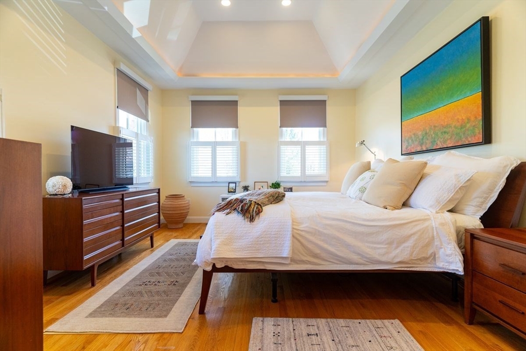 1 South Cottage Road, Unit 1 Belmont, MA 02478 - Photo 21 of 35 a bed room with a bed tv and a television