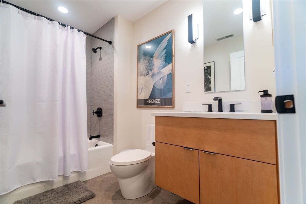 1 South Cottage Road, Unit 1 Belmont, MA 02478 - Photo 28 of 35 a bathroom with a sink toilet and shower