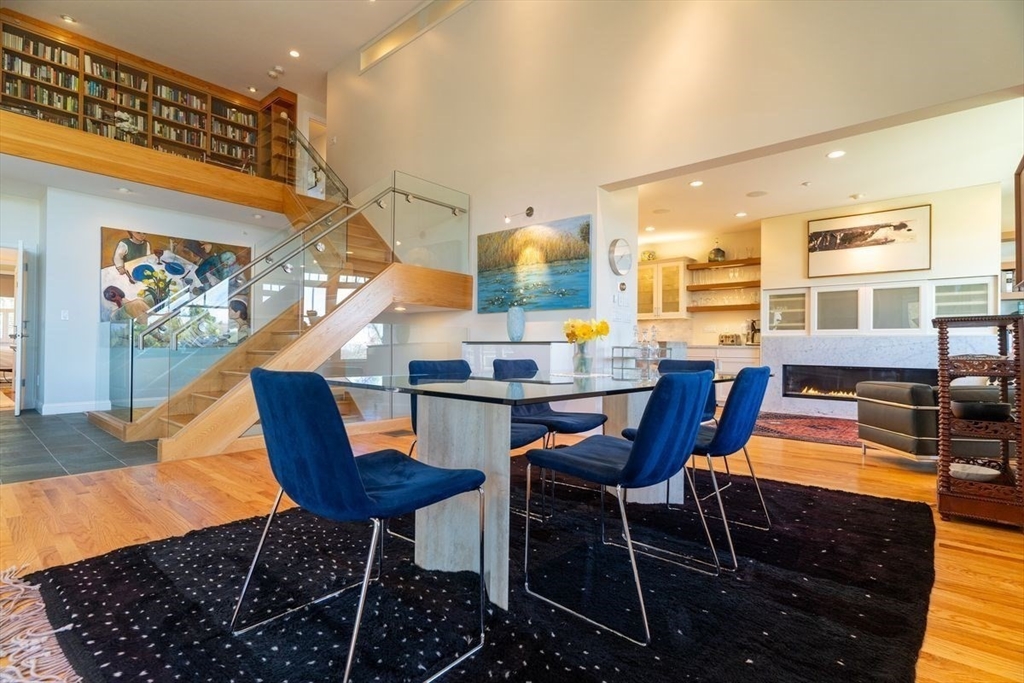 1 South Cottage Road, Unit 1 Belmont, MA 02478 - Photo 4 of 35 a dining room with furniture and wooden floor