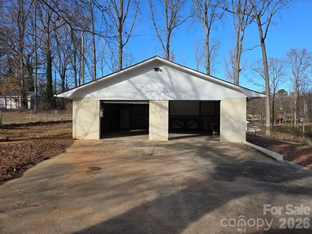 a front view of a house with garage