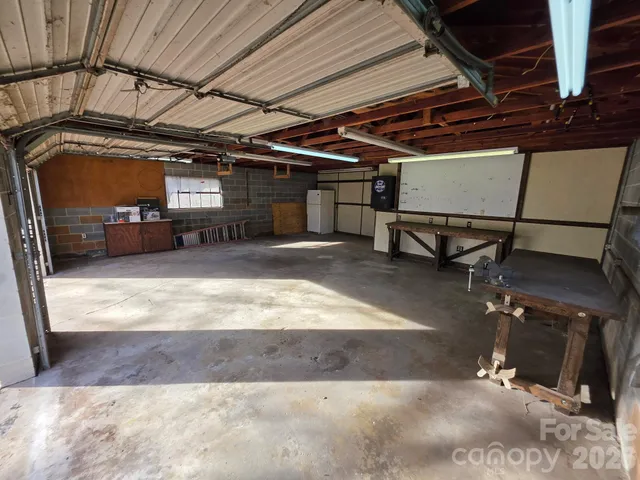 a kitchen with stainless steel appliances a stove a sink and a microwave