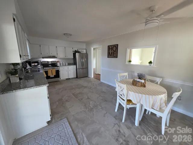 a view of a dining room with furniture