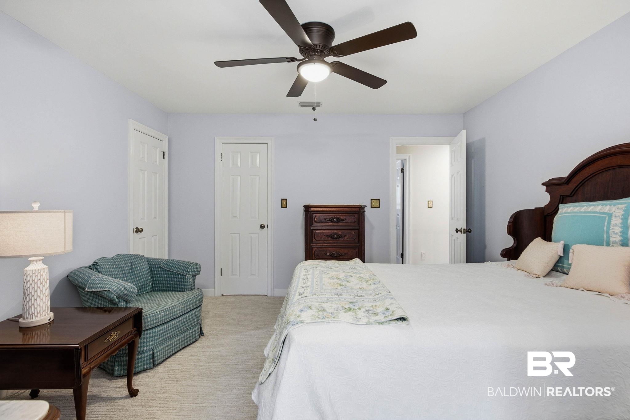 31515 Rhett Drive Spanish Fort, AL 36527 - Photo 56 of 100 Bedroom 4 measures 12' 11" x 20' 9" and has a walk in closet with locked storage, wooden shelving, a ceiling fan and walk out attic access. Additional space for a desk or sitting area by the dormer.