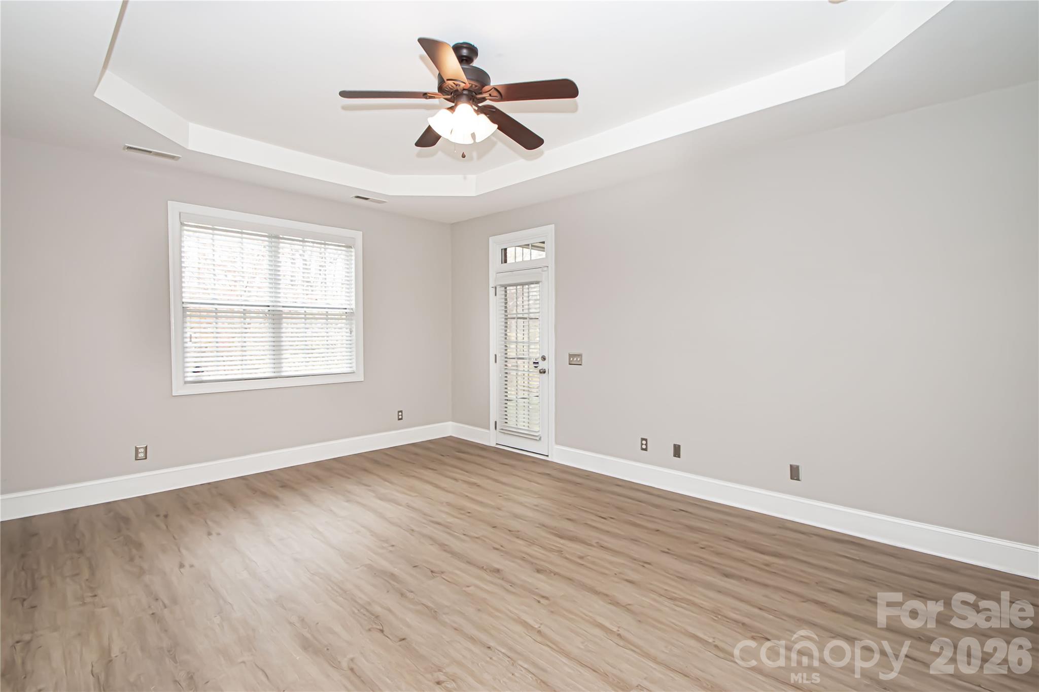 7900 Honey Fig Road Charlotte, NC 28277 - Photo 25 of 48 wooden floor in an empty room with a window