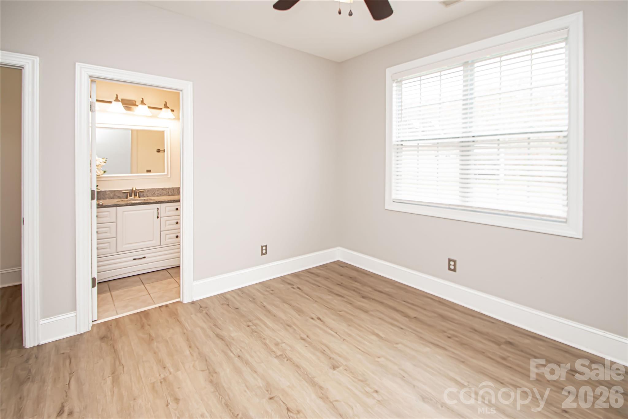 7900 Honey Fig Road Charlotte, NC 28277 - Photo 31 of 48 an empty room with cabinet and windows