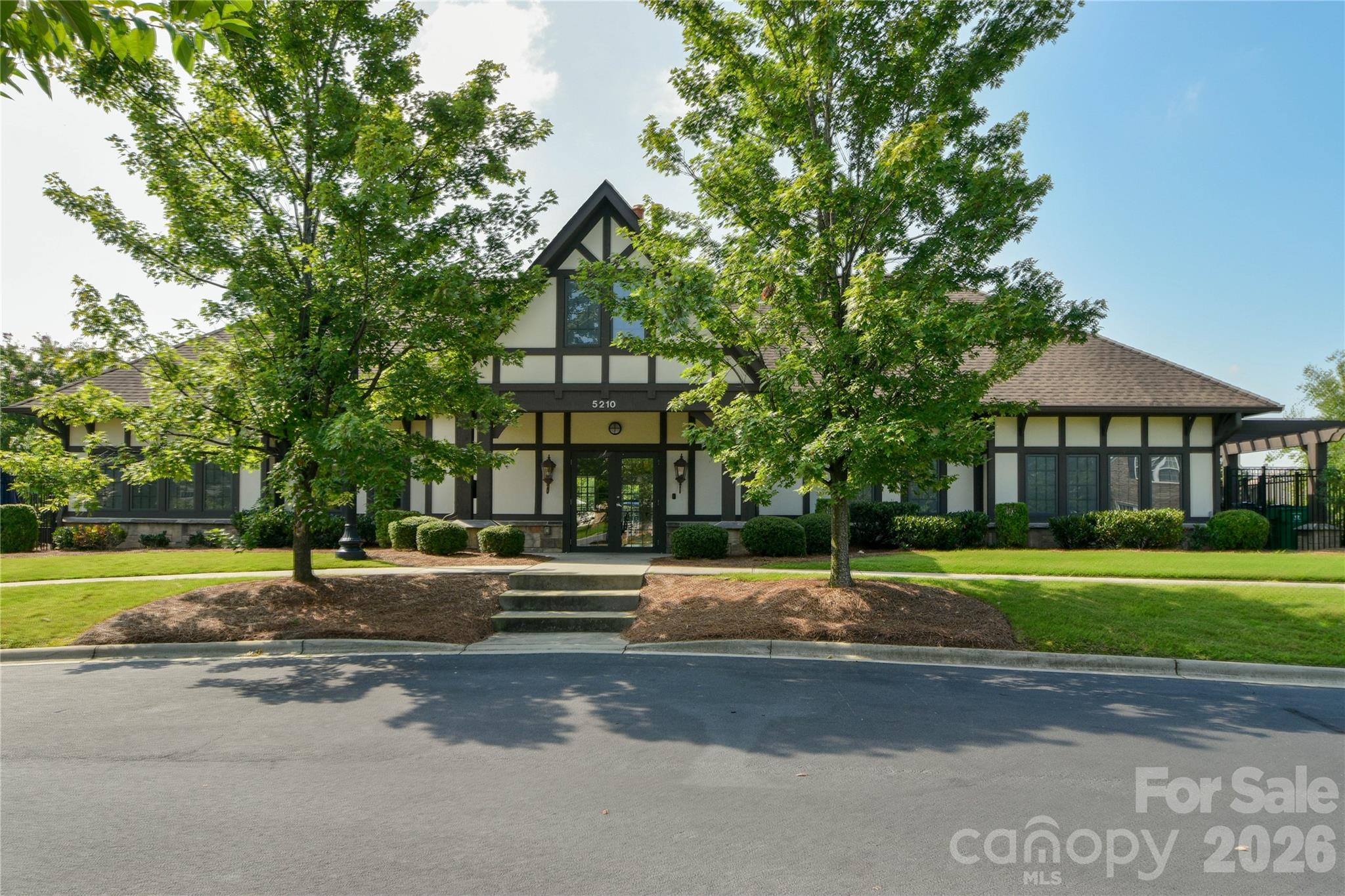 7900 Honey Fig Road Charlotte, NC 28277 - Photo 45 of 48 a view of a big house with a big yard and large trees