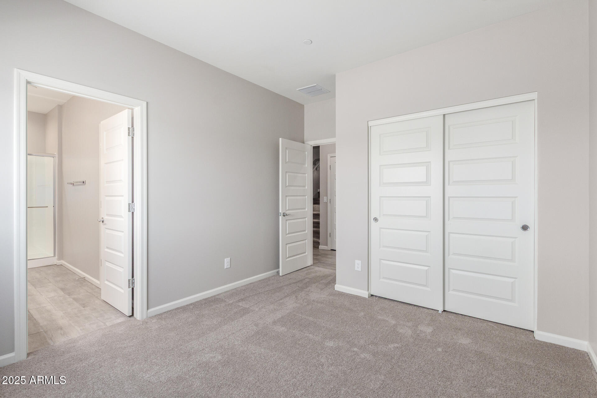 733 East Commonwealth Avenue, Unit 29 Chandler, AZ 85225 - Photo 15 of 37 an empty room with closet area