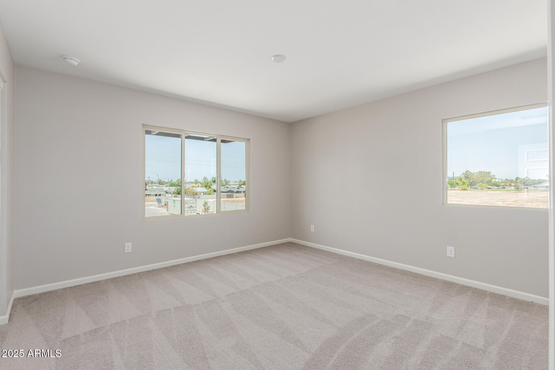 733 East Commonwealth Avenue, Unit 29 Chandler, AZ 85225 - Photo 23 of 37 an empty room with windows